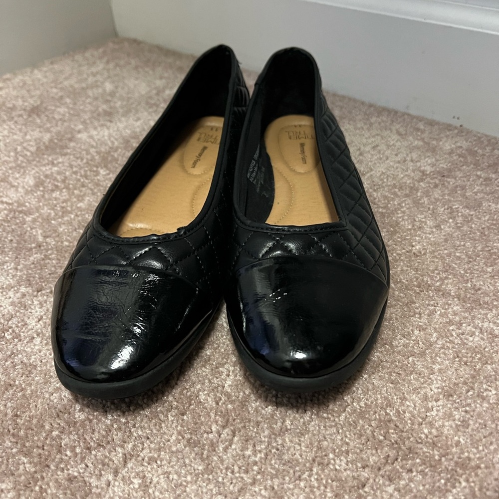 Black flats with quilting detail.